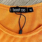 Boohoo cropped orange short sleeved top Photo 5