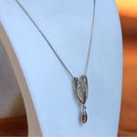 Silver Tone Necklace with Unique Pendant Charm Photo 0