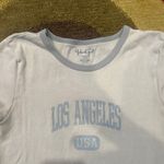Brandy Melville John Galt Los Angeles Graphic Baby Tee Shirt Crop Top Light Blue Photo 1