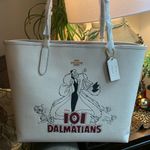 Coach Authentic Pebbled leather/signature coated canvas Cruella snap magnet tote Photo 1