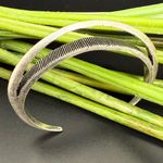 Jenny Bird  Silver-tone Textured Lines Open Design Cuff Bracelet 18.1g. Photo 1