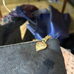 Juicy Couture new tags. I cannot open up the inside or it will cut the tag off. Photo 6