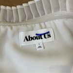 About Us  White Ruffle Crop Blouse Photo 5
