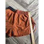 Alphalete  Woman’s Infinity Stride Short W/ Liner - Sour Tangerine, Size Small Photo 5