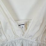 Reformation | Vivien Peplum Cotton Blend V-Neck Top in White Photo 6