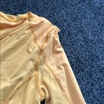 Lululemon size 10 thick Yellow Long Sleeve Top rounded bottom mesh detail EUC Photo 2