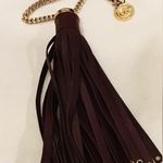 Michael Kors  Deep Chocolate Brown Tassel hang tag with Gold Hardware. Photo 0