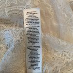 White House | Black Market ivory lace top with scalloped short sleeves and hem S Photo 12