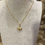 Dainty little elephant on a gold necklace.​​ Photo 1