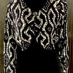 Nine West black/wht crop cardigan sweater. Size Medium. ***Refer to measurements as size tag removed. Beautiful. One large buttons @top. Gently warn & excellent condition. Measurements approximately 19” from armpit to armpit x 16” long. Non-smoking home. Priced at as is condition. Don’t like my price make a reasonable offer! And thank you for checking my closet! Photo 0