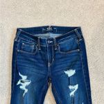 Hollister  distressed dark blue low rise super skinny jeans in size 2L or 26L Photo 1