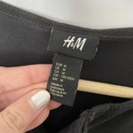 H&M women's Black Long-Sleeve Henley Shirt With Button Tab Sleeves Size M Photo 2