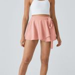 Halara  Skirt High Waisted Breezeful Tie Side 2in1 Side Pocket Mini Peach XS NWT Photo 0
