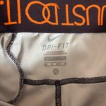 Nike  Women’s Leggings Capri Crop Running Reflective Zipper Pocket Orange Pink XS Photo 3