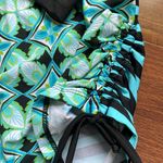 Title Nine  Rash Guard Side Scrunch Tie Black and Blue Two Sided Geometric Shapes Photo 1