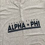 Alpha phi T Photo 1