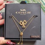 Coach  Gold Tone Studded Bow Slider Bracelet Photo 1