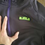 Nike  dri fit deep plum zip up size small women's.  Green details Photo 2