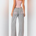 Edikted  PacSun light wash mid rise wide-leg jeans w/ pink bows; size M Photo 1