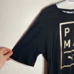 Puma  black modern t-shirt with framed gold spell out logo size S Photo 3