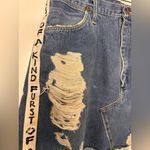 Furst of a Kind  Distressed Denim Skirt with Unique Side Straps Photo 3