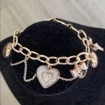 Guess Gold and Silver Charm Bracelet with Heart Photo 0