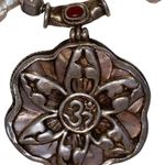 Keshi pearl & sacred OM mandala w/ unique charms along the string of pearls Photo 1