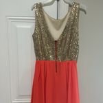 Alythea NWOT party dress. Gold sequins with peace bottom. Never worn and has been in bag Photo 2