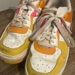 Nike Pink orange and yellow shoes Photo 2