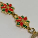 Women’s Poinsettia Quartz analog watch gold tone 25mm bracelet Size 7” running Photo 5