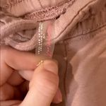 Free People movement dusty rose colored joggers with ankle zip and drawstring Photo 8