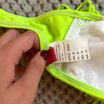 Guess Lightly used  neon green fringe bathing suit top size medium Photo 3