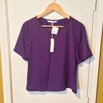 Trina Turk  women's "Black Orchid" Hanford cut out back short sleeve shear blouse Photo 0