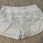 Lululemon  white mid rise speed up shorts 4” size 10 Photo 0