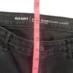 Old Navy  super skinny mid rise size 10 regular black jeans Photo 7