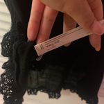 Free People  black strappy cutout flowy lace hem tank Photo 9