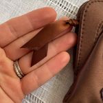 Avon NWOT Y2k chocolate brown clutch with floral design. Photo 4