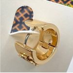 Tory Burch Authentic Britten Huggie Earring , In Tory Gold. Photo 1