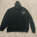Black hoodie with heart design, size medium Photo 0