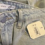 Altar'd State  high-waisted light wash ripped distressed raw hem jeans Size 27 Photo 5