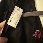 ASOS DESIGN embroidered tiered smock playsuit in black Size 0 Photo 4