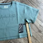 Alphalete NEW  Woman’s  ELMTS Short SLEEVE Crop - Teal , Size Medium Photo 3