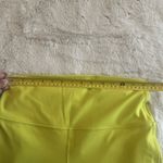 Lululemon women's high-rise leggings in neon yellow. Stretchy, Size 12 Photo 5