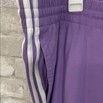 Adidas Women's Purple Joggers with White Stripes Photo 1