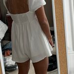 Princess Polly White Ruffle Romper Photo 1