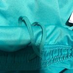 Adidas  sea green/pink running shorts sz medium Photo 4