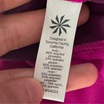 Athleta Women’s  Track This Run Shorts Fuchsia Zip Pocket Stretch size small Photo 4