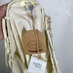 Kori  America Ivory Textured Ruffled Button Accent Tank Top Photo 3