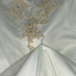 David's Bridal . Style T8818 size 10 wedding dress. 
Worn once. Was cleaned. Photo 14