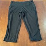 Tangerine  ladies capri tights are a size small. Photo 5